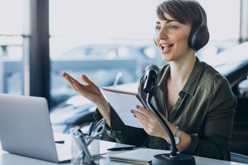 Young woman with microphone working in call center